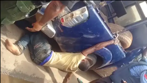 Police Chain Young Man To The Back Of Their Hilux, Drag Him Along The Road (Photos)